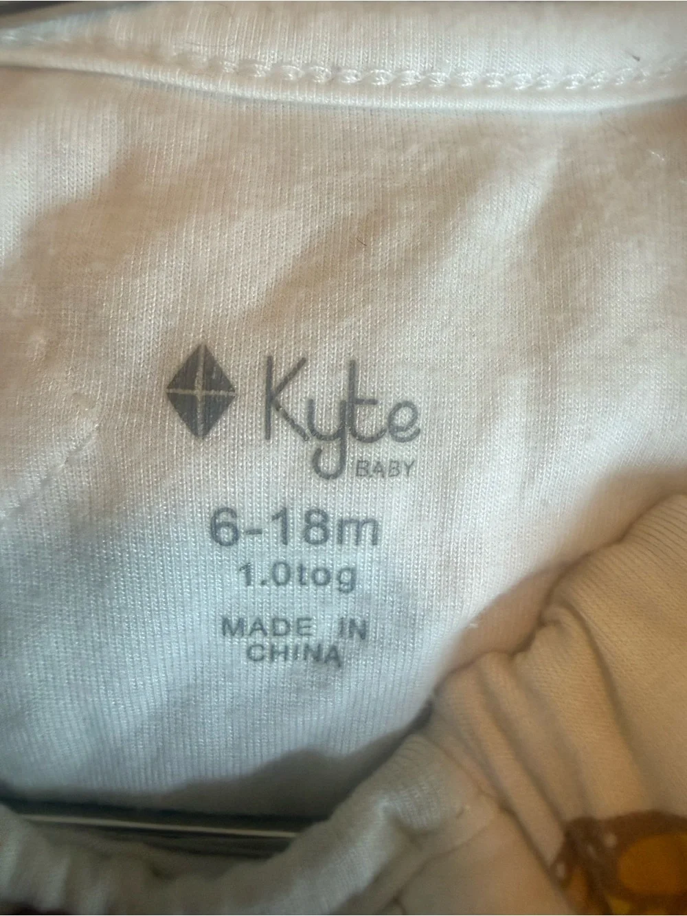 Kyte BABY monarch Cream Infant sleep sack with Subtle Gray Logo